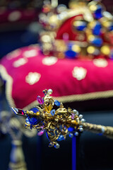 Wall Mural - Close-up of the top of the scepter with the royal crown in the background.