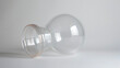 A clear plastic cup with a thick rubber bulb on one end used for fire cupping to create suction by heating up the air inside the cup.