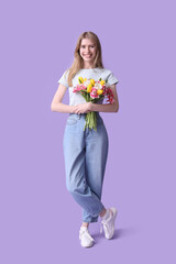 Poster - Happy young woman with bouquet of beautiful tulips on lilac background