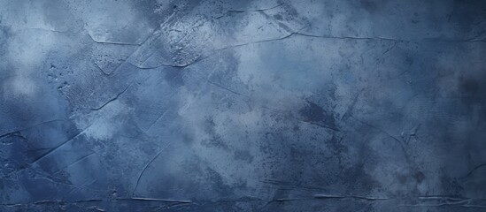 Poster - A close up of a grey wall with an electric blue sky filled with cumulus clouds in the background, creating a freezing natural landscape with a dramatic meteorological phenomenon