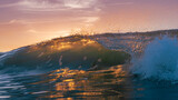 Fototapeta Miasta - Crashing Wave backlit by sunset