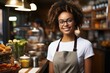 Portrait of happy african american woman standing at doorway of cafe or restaurant