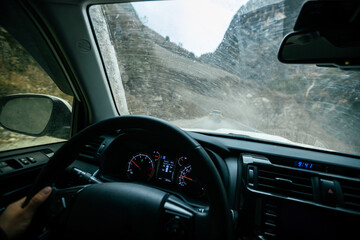 Wall Mural -  Driving car on the high altitude mountain trail in tibet,China