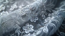 Delicate Floral Lace Fabric Draped, Highlighting Its Intricate Patterns.