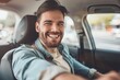 © ffunn - Handsome young man is driving a car and smiling. He is sitting on the steering wheel and looking at camera