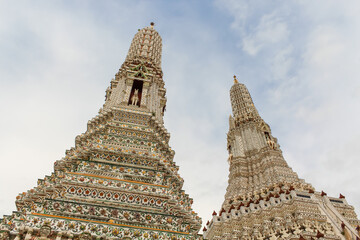 Wat Arun temple in a blue sky in Bangkok, Thailand.