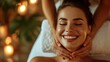 Beautiful woman getting face massage in beauty spa. Girl with closed eyes relaxing spa while getting head massage