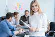 © opolja - Portrait modern business woman in the office with copy space. Female executive wearing casual standing in modern meeting room