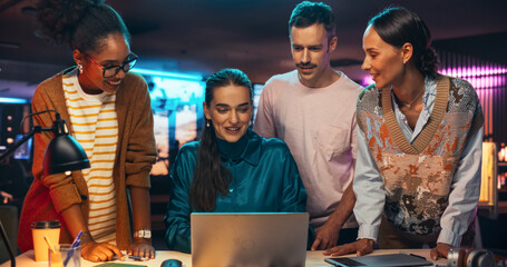 Poster - Multiethnic Group of People Working on Developing Growth Ideas Based on Data Using Laptop Computer. Energetic Teammates Brainstorming For Marketing Strategy in a Creative Office at Night