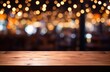 © Goojournoon - Empty wooden table top with blurred background of bar or cafe at night for product display montage, banner design.