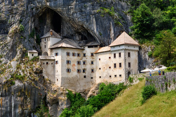 Sticker - Predjama, Slovenia - June 27, 2023: Predjama Castle in Slovenia, Europe. Renaissance castle built within a cave mouth in south central Slovenia.