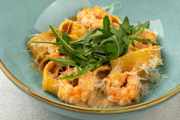 Canvas Print - Closeup on portion of italian pappardelle pasta with shrimp