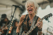 An energetic grandmother on stage screaming a song with all her might while shredding on an electric guitar