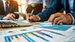 © wiparat - Business idea. Business people talking And calculations about charts and graphs showing the growth of investment results Of successful teamwork