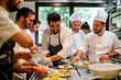 © mirifadapt - Teamwork in the kitchen. A group of chefs working together in a busy restaurant, preparing meals on kitchen