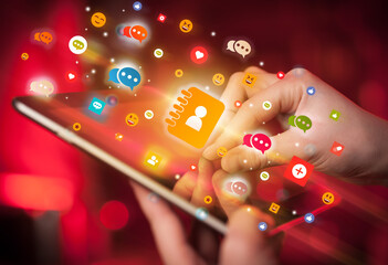 Aufkleber - Close-up of a hand using tablet with social media icons