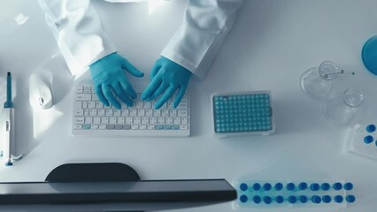Aufkleber - A bacteriologist works in a laboratory where the structure and properties of bacteria are studied. Under a microscope, she analyzes samples, and at the computer, she develops strategies for