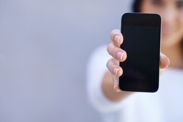 Poster - Presentation, mockup and phone on hand in studio background for product placement. Digital, female person and girl advertising for mobile or smartphone, technology and connection to internet