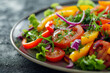 Close-up of a Fresh, Organic garden salad with tomatoes. Greens. Lettuce. Bell peppers. Arugula. And microgreens. A healthy and colorful vegan and vegetarian side dish. On a plate