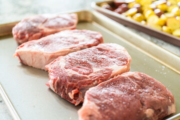 Canvas Print - Seasoned Rib Eye Steak Ready for Grilling