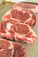 Canvas Print - Seasoned Rib Eye Steak Ready for Grilling