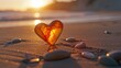 A piece of amber, shaped like a heart, lies on a sandy beach, bathed in the gentle glow of the sun as it sets.