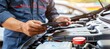 Expert car mechanic s skilled hands repairing vehicle in professional auto repair service