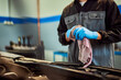 © bnenin - Photo of a mechanic's hands, wearing protective gloves, using a cloth, and cleaning hands.
