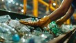 Close-up of gloved hands sorting plastic bottles on a recycling conveyor, embodying waste management.