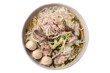 Thai rice noodle soup with pork in bowl, top view