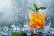 Refreshing mint julep cocktail with ice splashes on a grey background