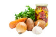Close-up of a set of vegetables and hot peppers in a jar on an isolated background