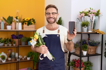 Sticker - Middle age man with beard working at florist shop showing smartphone screen smiling with a happy and cool smile on face. showing teeth.