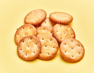 Wall Mural -  Delicious group of salty biscuits over isolated yellow background