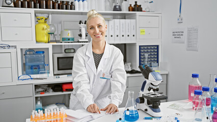 Sticker - Confident young blonde woman scientist, all smiles while taking diligent notes in the bustling lab, bridging science and beauty. a beacon of hope in medical research.