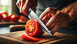 Closeup hand of chef cutting tomato with knife