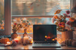 Home office desk with open laptop, seasonal decor like candles, flowers, pumpkins. grid mood board with fall colors palette. Autumn inspiration and cozy mood. Hygge home fall decor. Selective focus