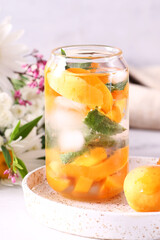 Wall Mural - refreshing summer drink with oranges and apricots