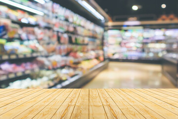 Sticker - Empty wood table top with supermarket blurred background for product display