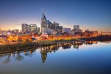 Fototapeta Miasto - Nashville, Tennessee, USA. Cityscape image of Nashville, Tennessee, USA downtown skyline with reflection of the city the Cumberland River at spring sunset.