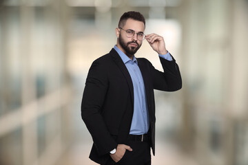 Poster - Successful lawyer in glasses on blurred background