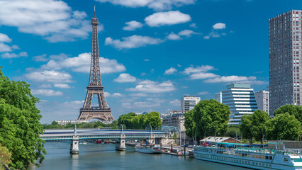 Wall Mural - Eiffel tower at the river Seine timelapse from bridge in Paris, France