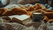 book and a mug of coffee and tea on the bed