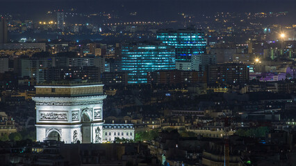 Wall Mural - Aerial Night timelapse view of Paris City and Triumphal Arch shot on the top of Eiffel Tower