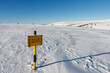 A sign warning of the avalanche area, white elbe valley, krkonose mountains, winter day.