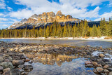 Fototapeta Sport - Castle Mountain in Banff National Park, Canada, with reflection on puddle along the Bow River