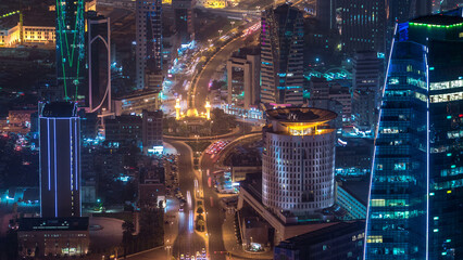 Sticker - Skyline with Skyscrapers night timelapse in Kuwait City downtown illuminated at dusk. Kuwait City, Middle East