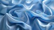 Abstract blue wavy crumpled shiny satin silk fabric textured textile background