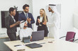 © oneinchpunch - Multiethnic business team working in Dubai
