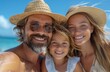 © Raptecstudio - A happy family wearing sun hats takes a fun selfie by the water on the beach